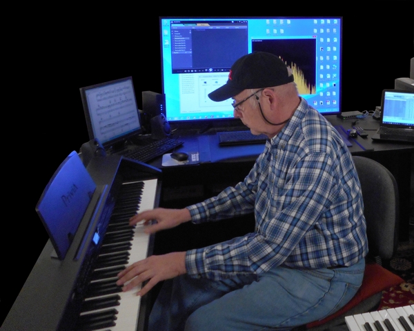 Photo of Reeves at Keyboard as shown on the Reeves Motal Piano and Synthesizer Music Website 